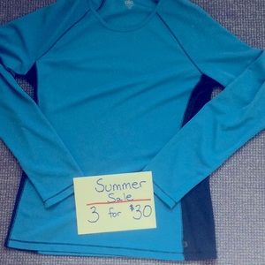Long sleeve turquoise and navy exercise top